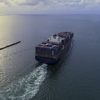 Photo of cargo ship heading out to sea.